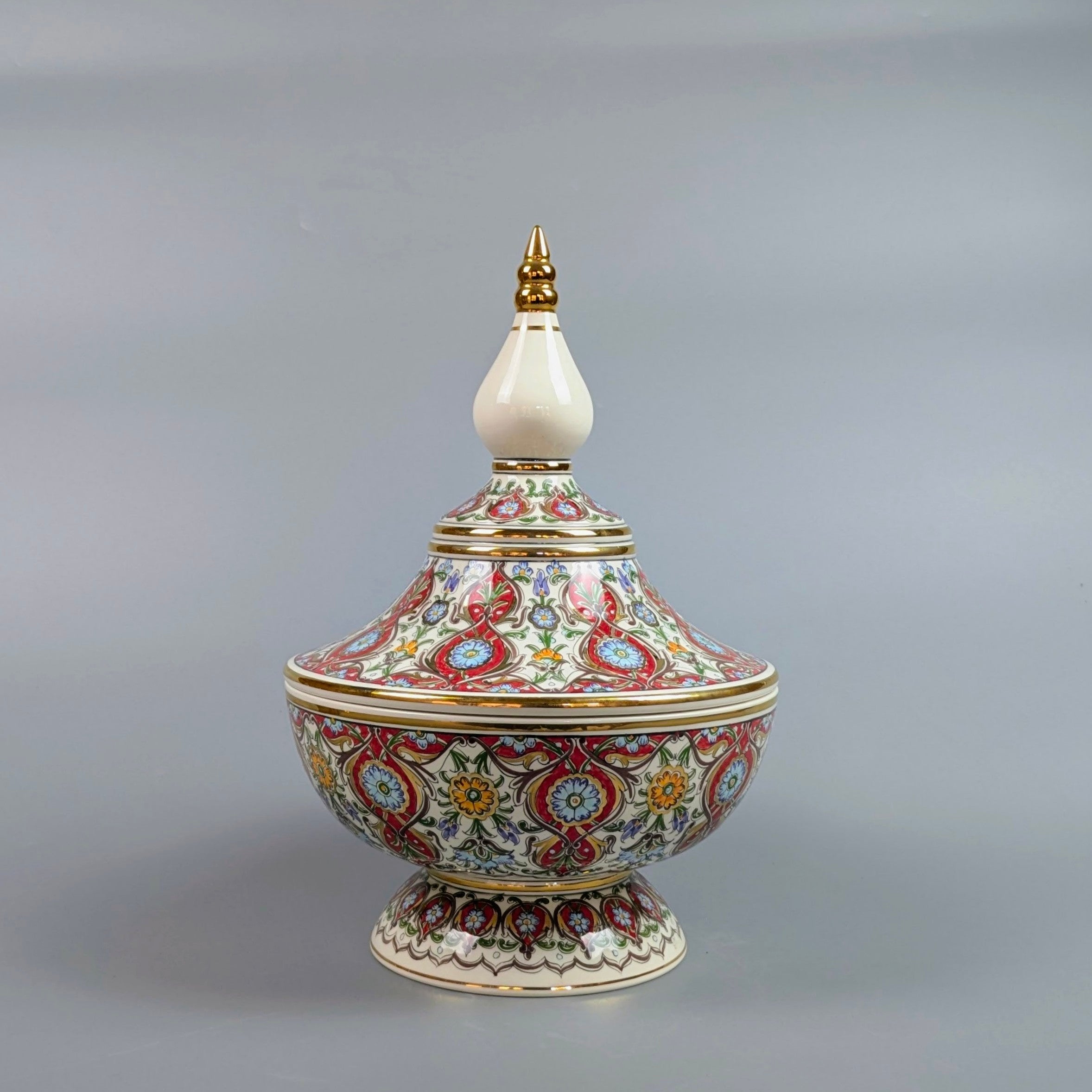 Decorative ceramic vase with intricate patterns on a gray background