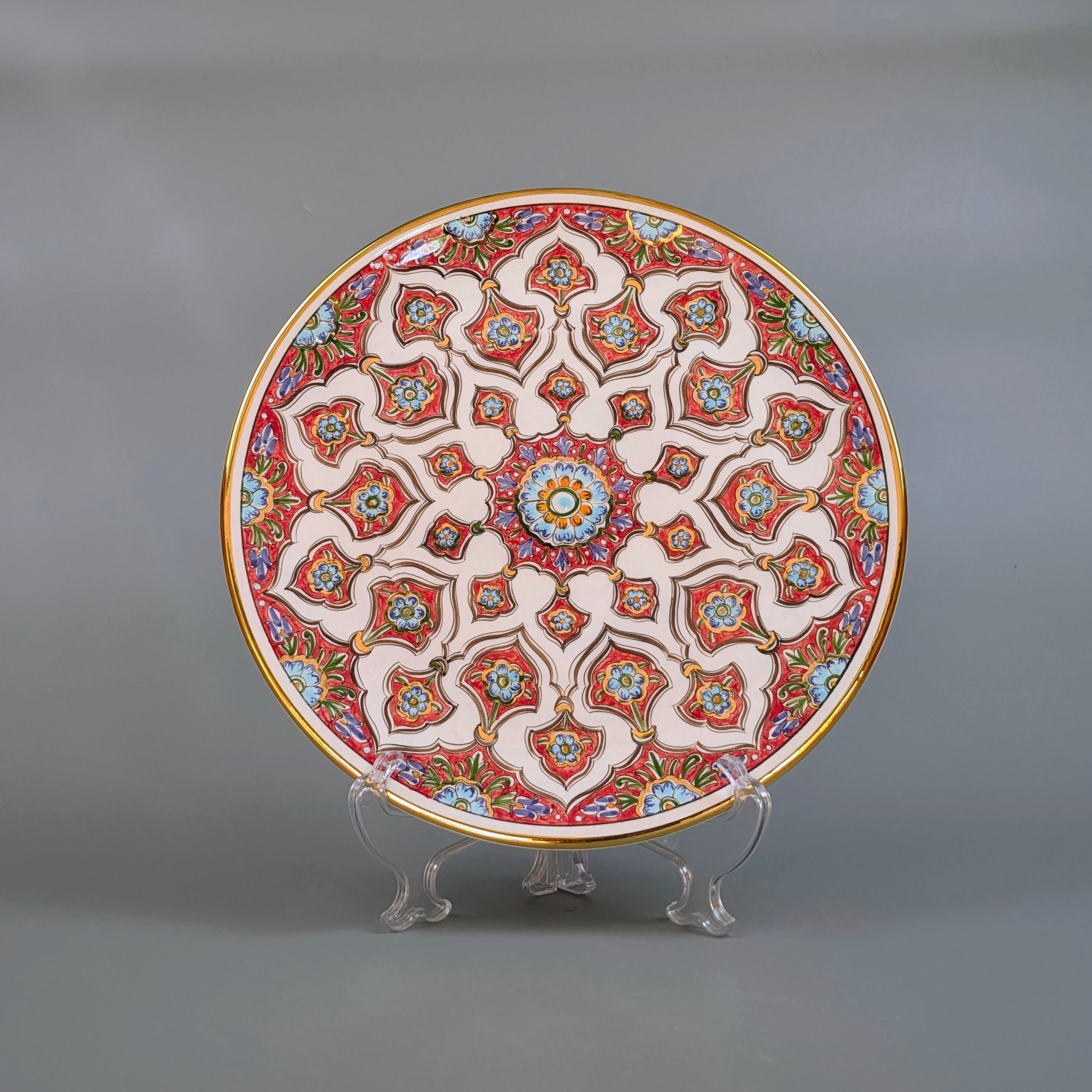 Decorative ceramic plate with intricate patterns on a gray background