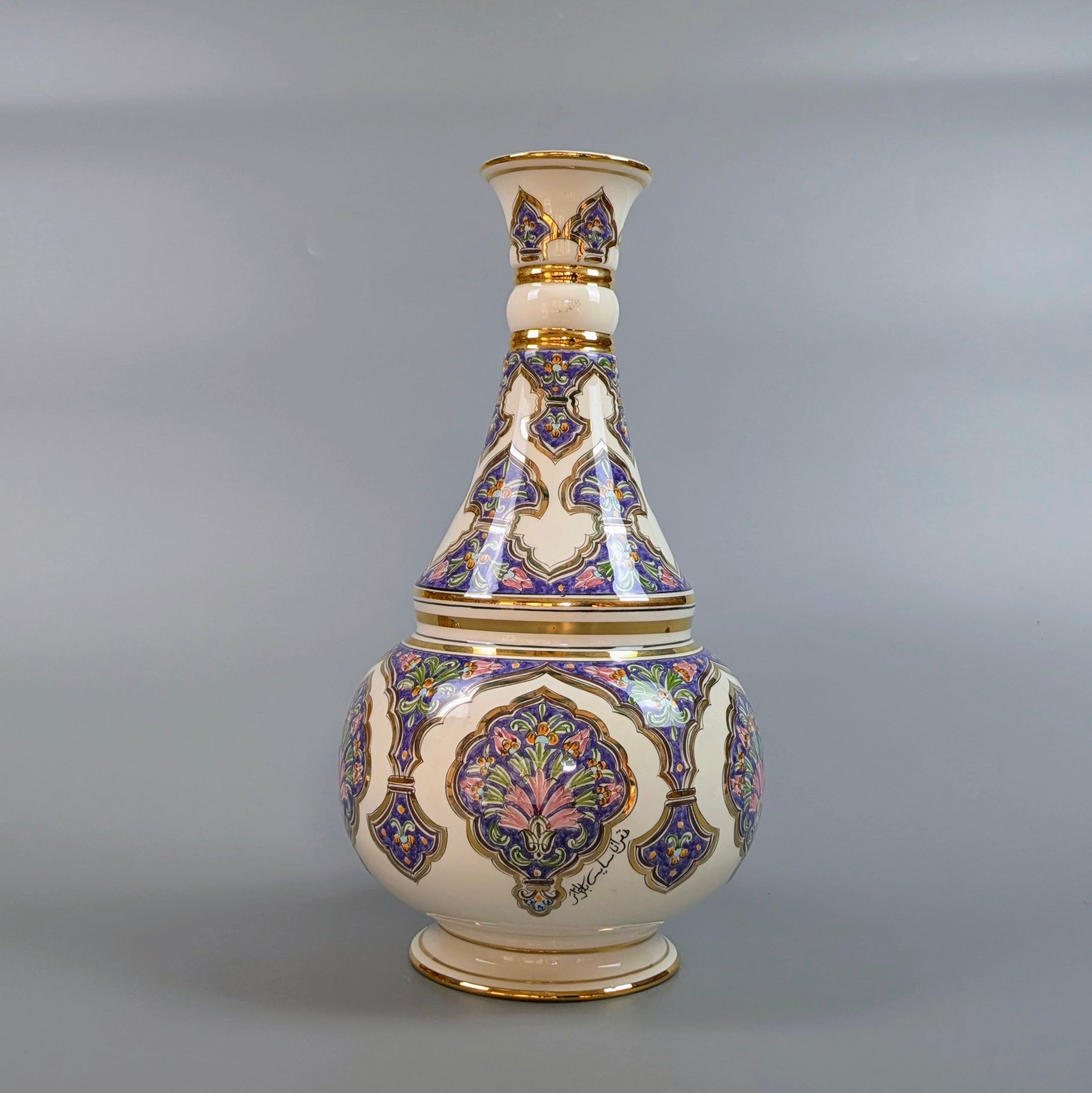 Decorative vase with intricate patterns on a gray background