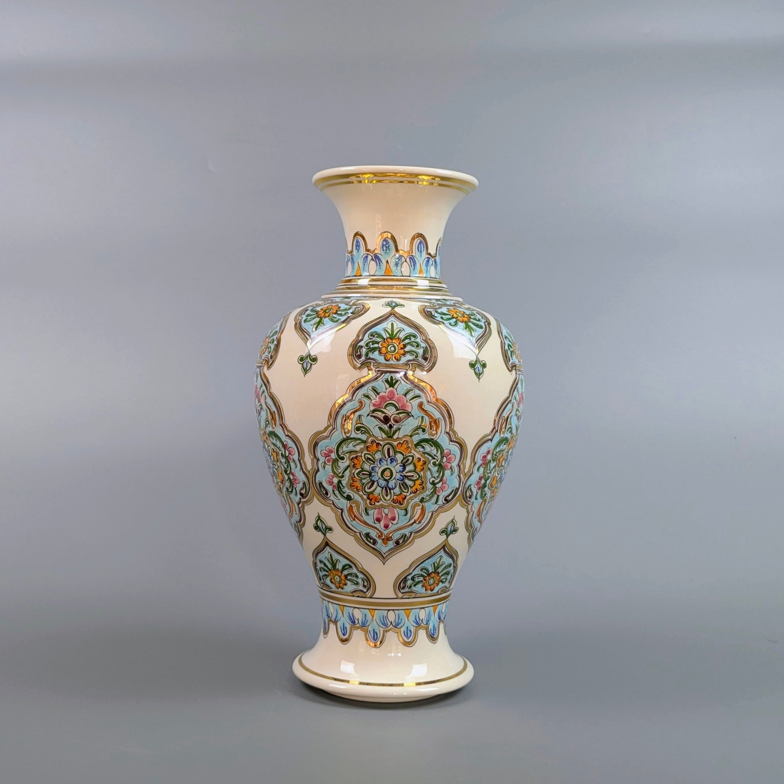Decorative vase with intricate patterns on a gray background