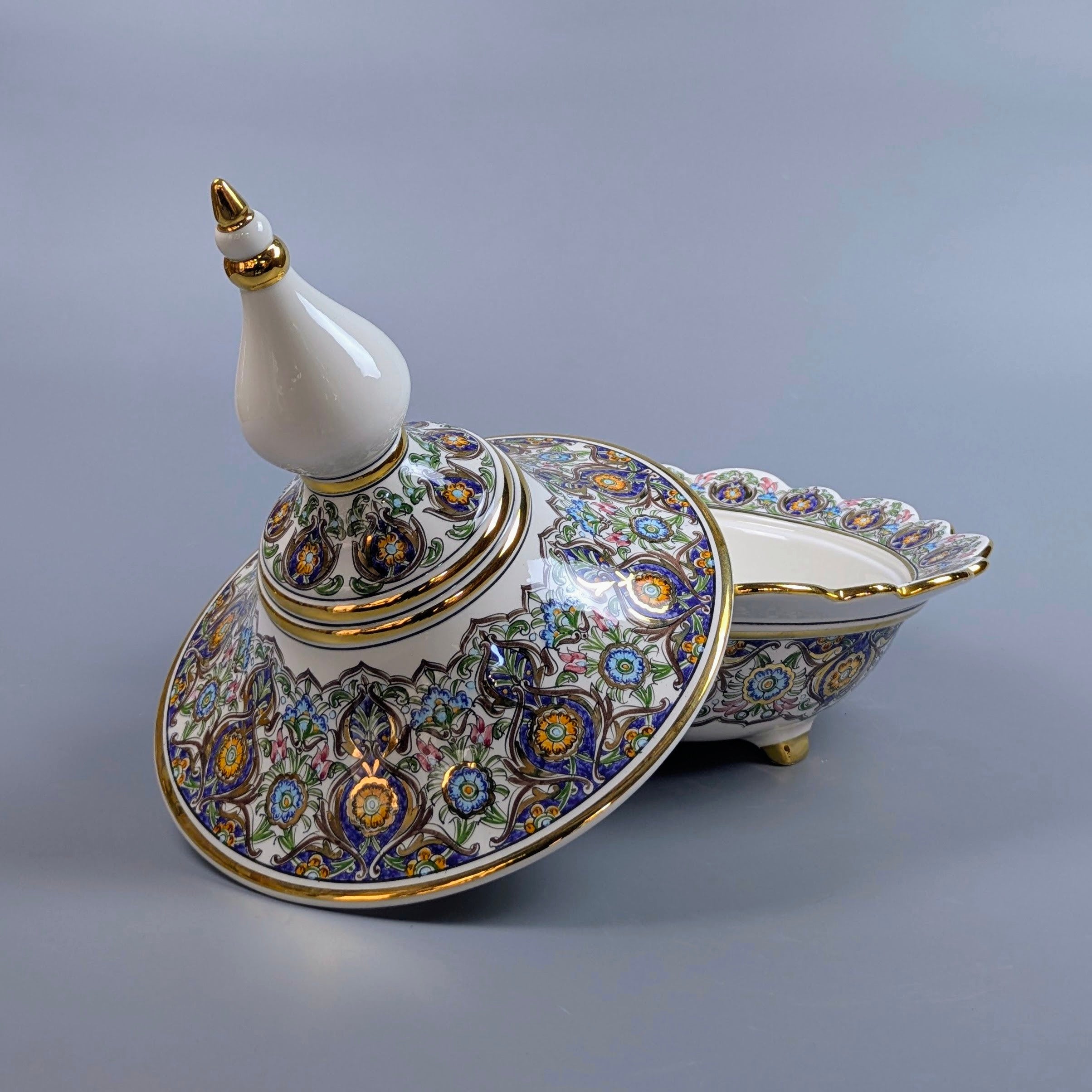 Decorative ceramic dish with intricate patterns on a gray background