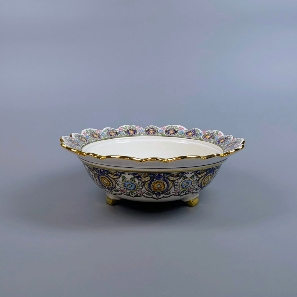 Decorative ceramic bowl with intricate patterns on a gray background