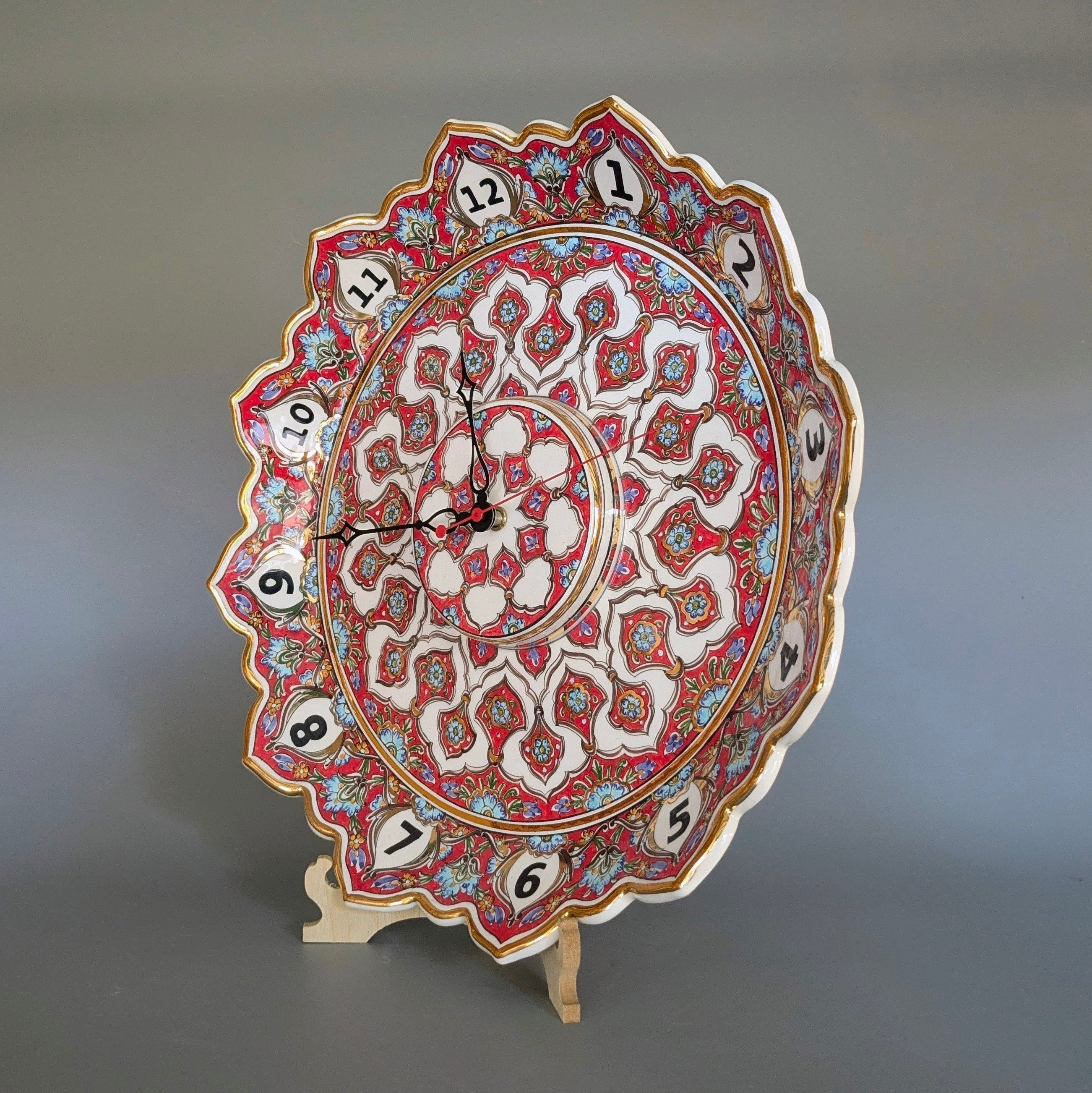 Decorative clock with intricate patterns on a gray background