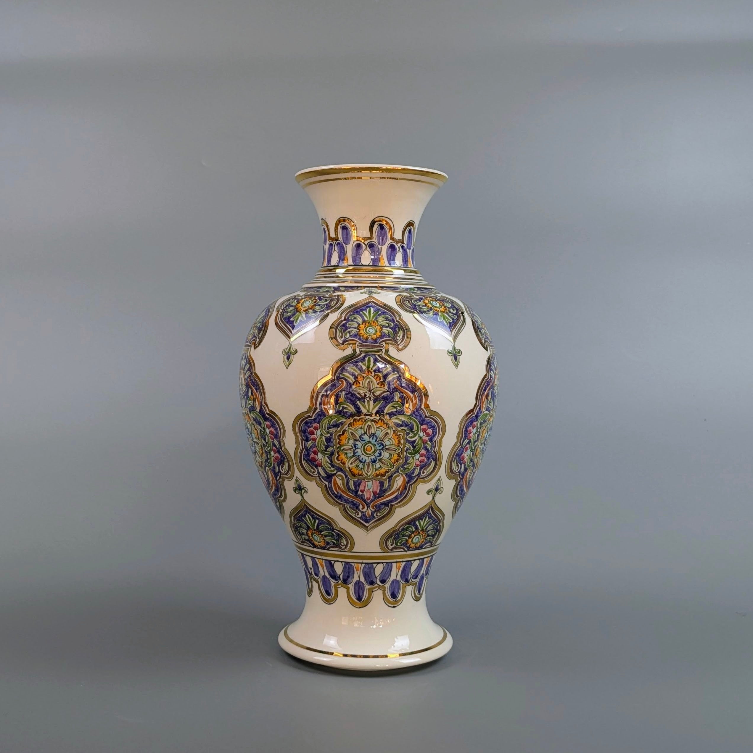 Decorative vase with intricate patterns on a gray background
