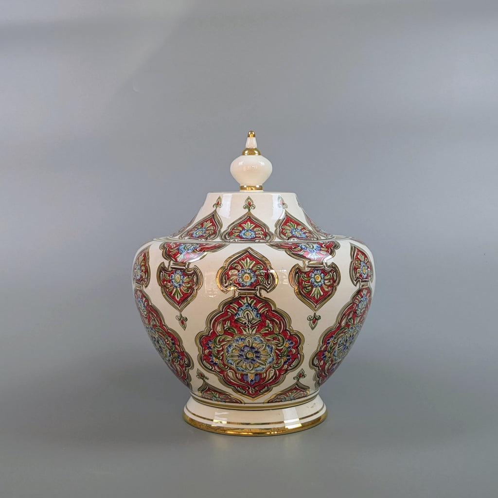 Decorative ceramic jar with intricate patterns on a gray background