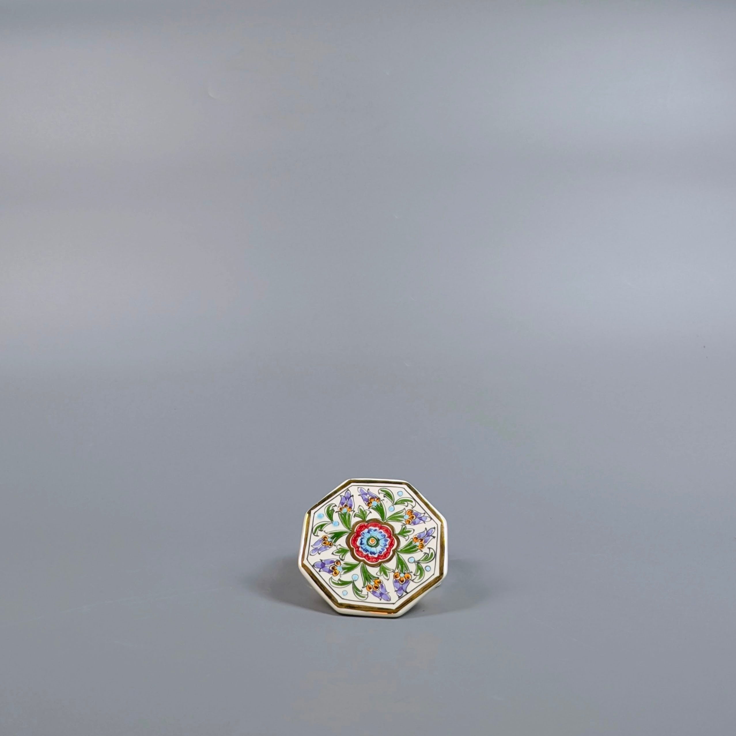 Decorative plate with floral design on a gray background