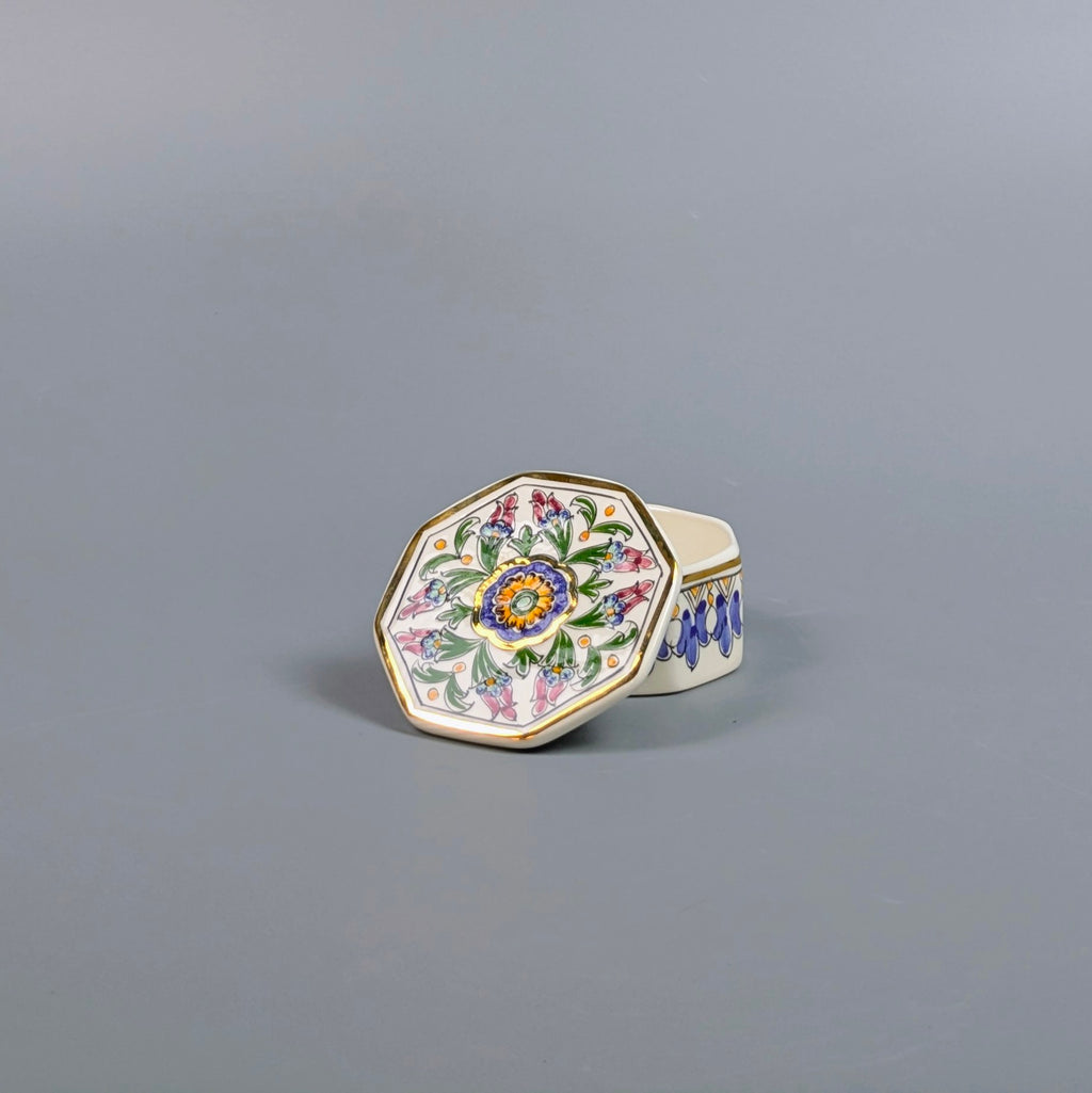 Decorative ring with floral design on a gray background