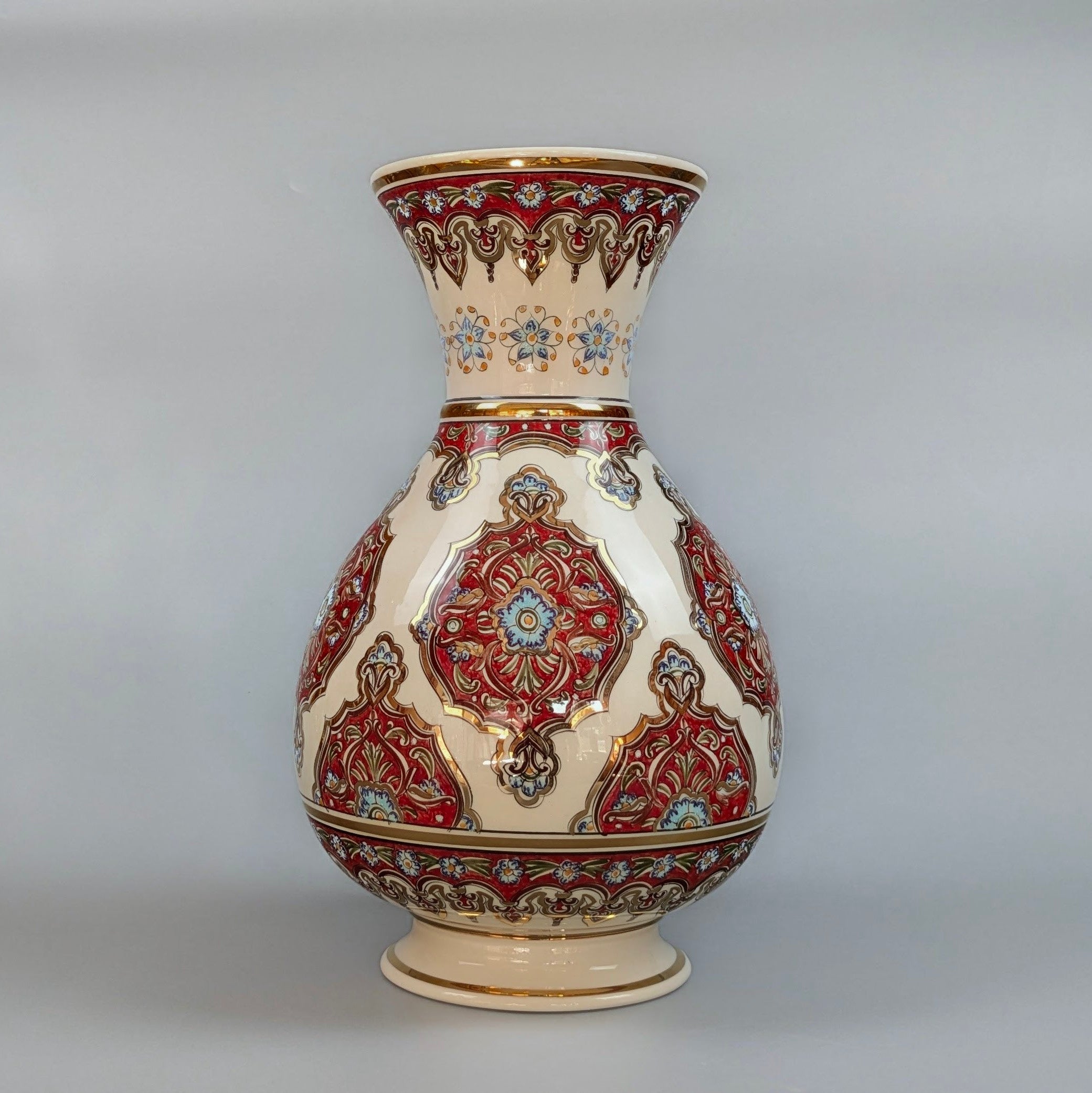 Decorative ceramic vase with intricate patterns on a gray background