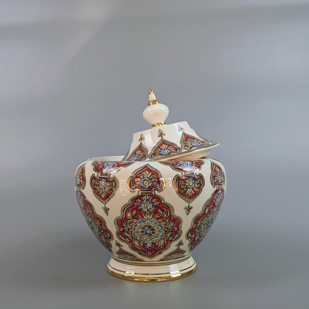 Decorative ceramic jar with intricate patterns on a gray background