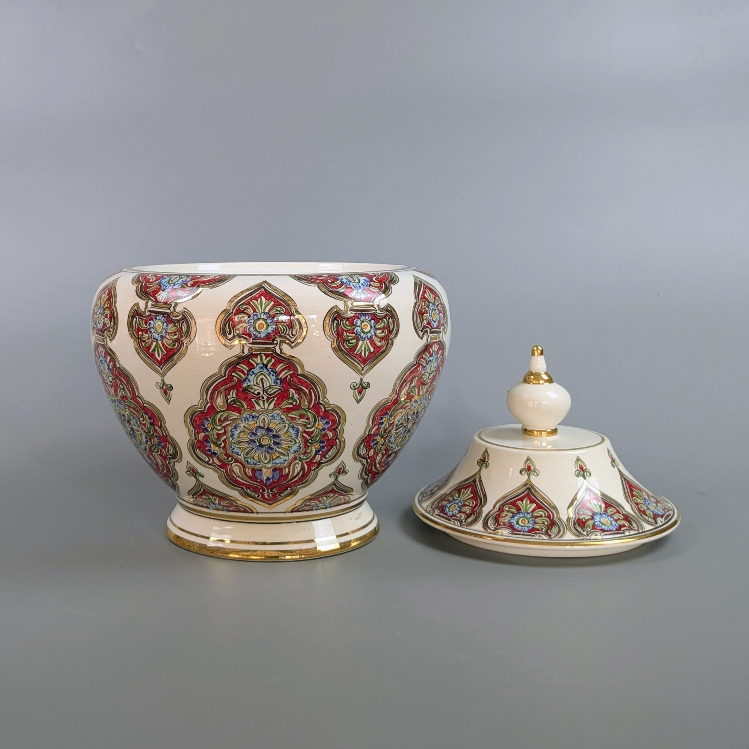 Decorative ceramic jar with intricate patterns on a gray background